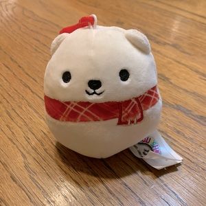 Brooke the polar bear with a scarf!!! She is a clip on Squishmellow by Kellytoy.